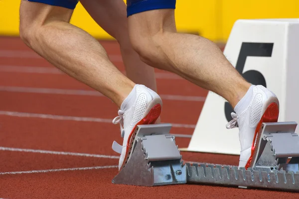 Runner in starting blocks — Stock Photo, Image