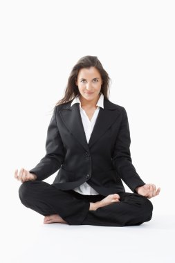 Businesswoman exercising yoga