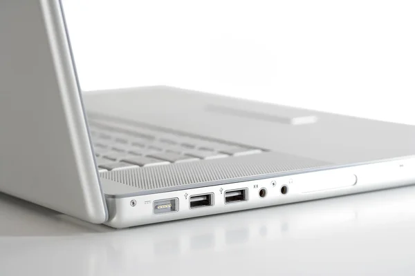 Laptop auf weißer Seite — Stockfoto