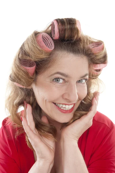 Frau mit Haarrollen — Stockfoto