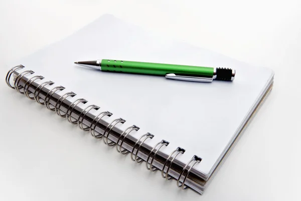 Pen nad notebook Stockbild