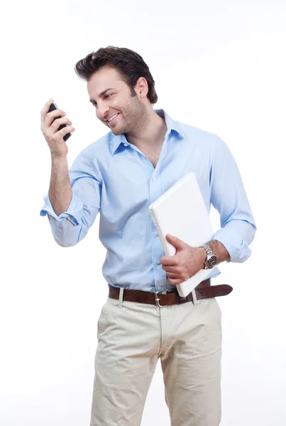 Homme avec ordinateur portable et téléphone portable — Photo