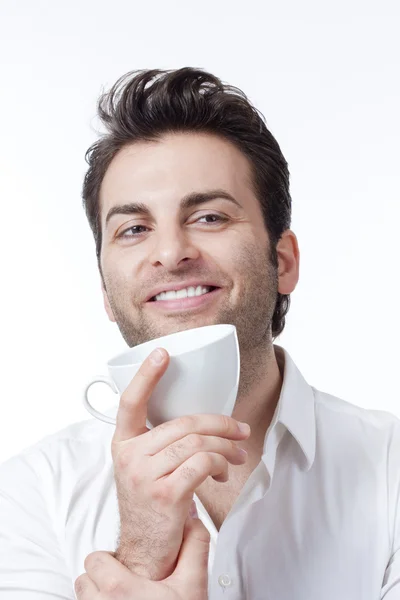 Человек держит чашку кофе — стоковое фото