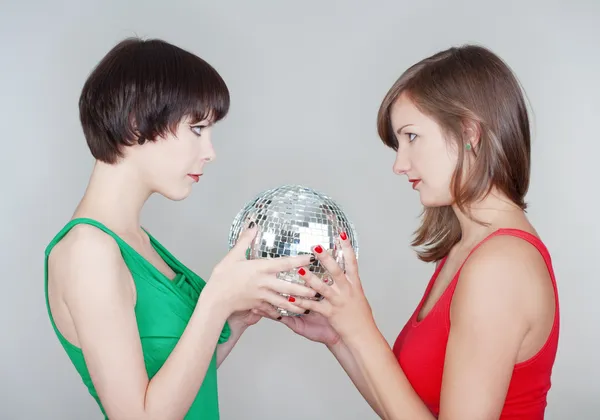 Girls holding a disco ball — Stock Photo, Image