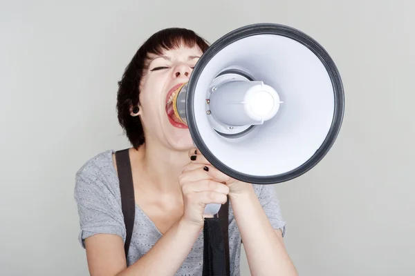 Girl with a megaphone — Stock Photo, Image