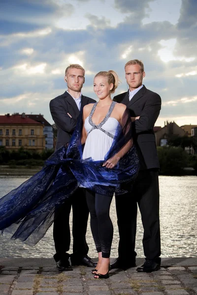 Beautiful woman and her bodyguards — Stock Photo, Image