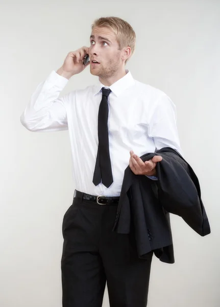 Joven hombre de negocios en un teléfono —  Fotos de Stock