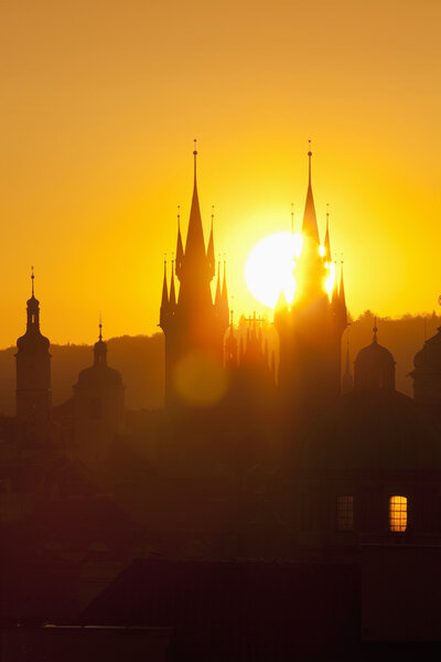 Czech republic, prague - spires of the old town and tyn church at sunrise