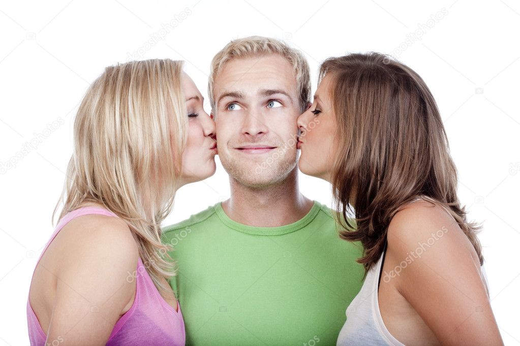 Man being kissed by two girls