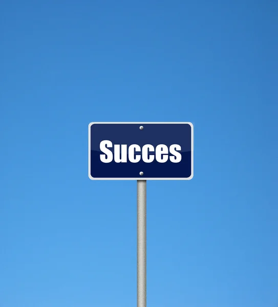 Sinal de sucesso em um fundo azul — Fotografia de Stock