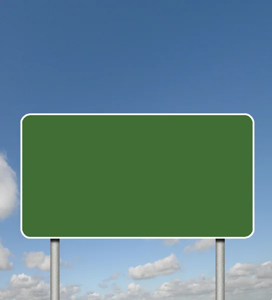 Blank green sign on a sky background Royalty Free Stock Images