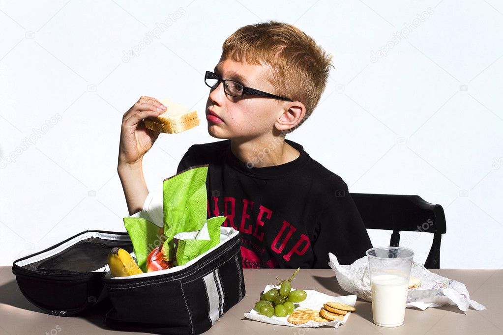Boy Eating Lunch at School
