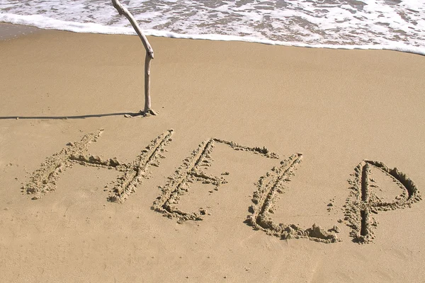 stock image HELP written in Sand