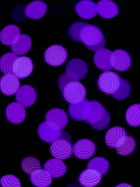 Wazig beeld van paarse lampjes — Stockfoto