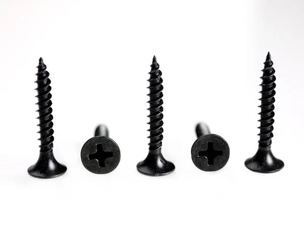 Cinco parafusos pretos — Fotografia de Stock