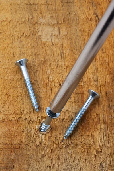 Screwing a screw into wood — Stock Photo, Image