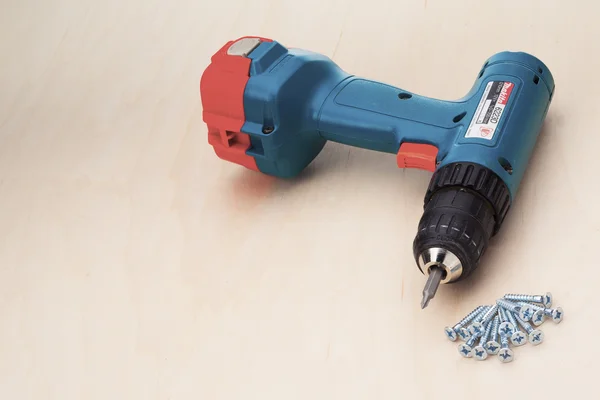 Powerdrill with new screws — Stock Photo, Image