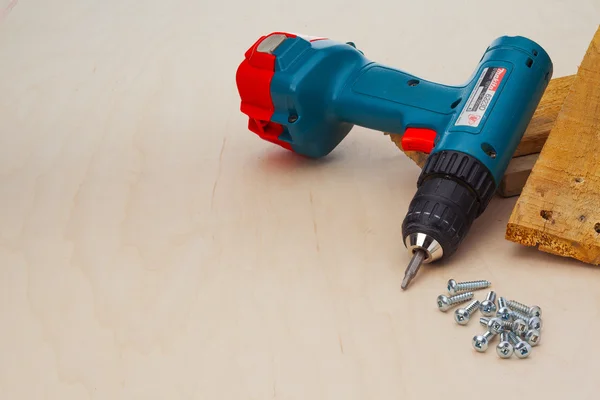 Powerdrill and screws — Stock Photo, Image