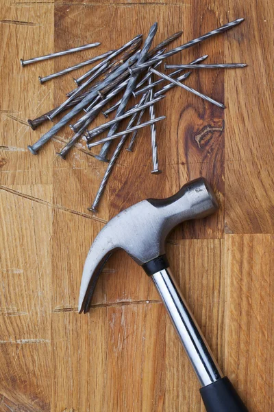 Nails and a hammer — Stock Photo, Image