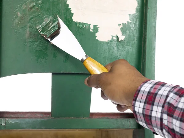 Person removing paint with chisel — Stock Photo, Image