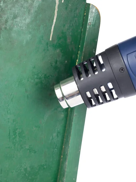 Imagem de close-up de arma de calor sobre tinta verde — Fotografia de Stock