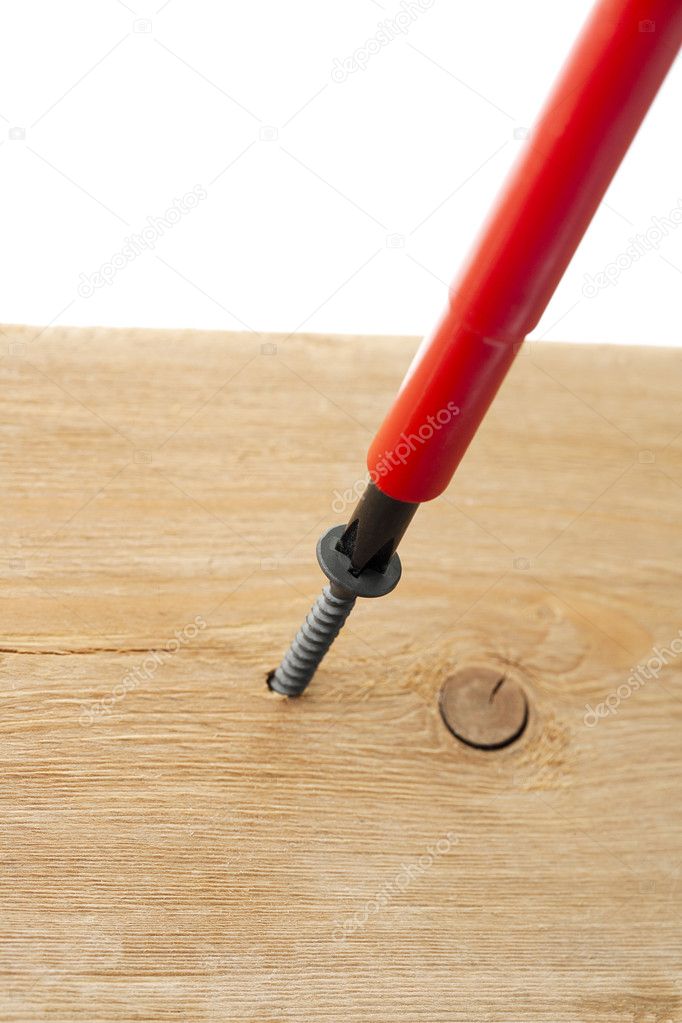 Screwdriver on woodscrew