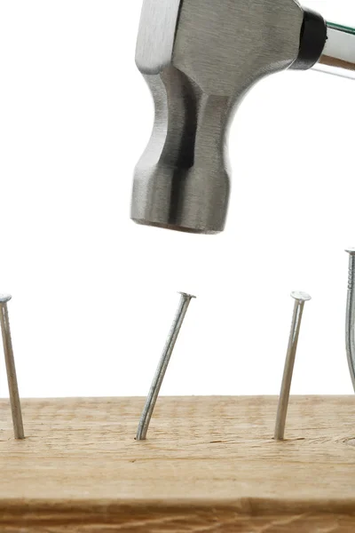 Hammering nails on wood — Stock Photo, Image
