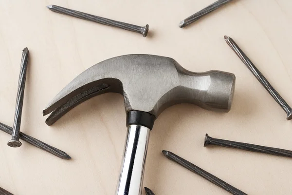 Hand hammer and metal nails — Stock Photo, Image