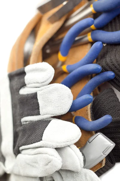 Macro image d'une ceinture à outils et gants à main — Photo