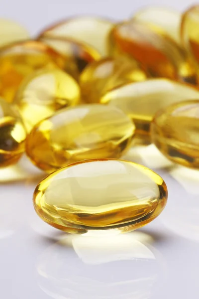 Żółte tabletki witaminy e żele miękkie — Zdjęcie stockowe