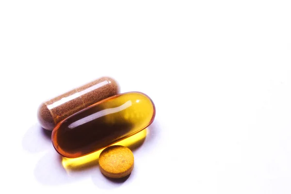 Macro pills over white background — Stock Photo, Image