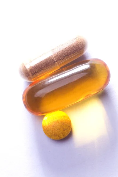 Macro pills over white background — Stock Photo, Image