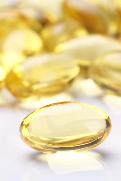 Sárga tablettákat e-Vitamin lágyzselé kapszula Stock Fotó