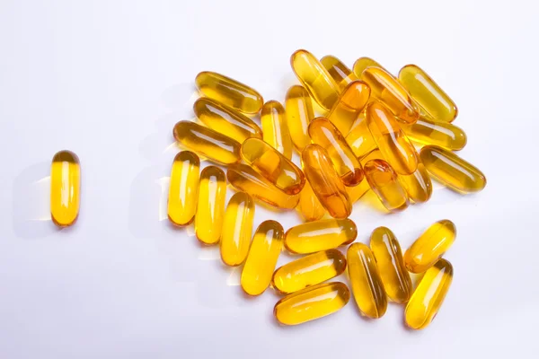 Een bos van gele gel pillen-visolie — Stockfoto