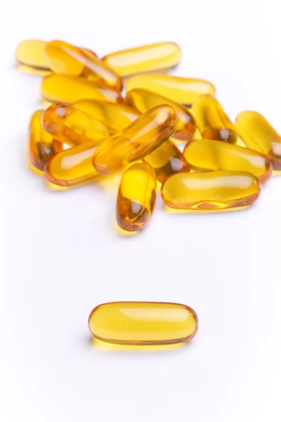 A bunch of yellow gel pills-fish oil — Stock Photo, Image