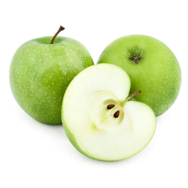 Два зеленых яблока и половина яблока — стоковое фото