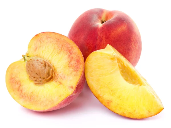 Свежие персиковые фрукты и половина — стоковое фото