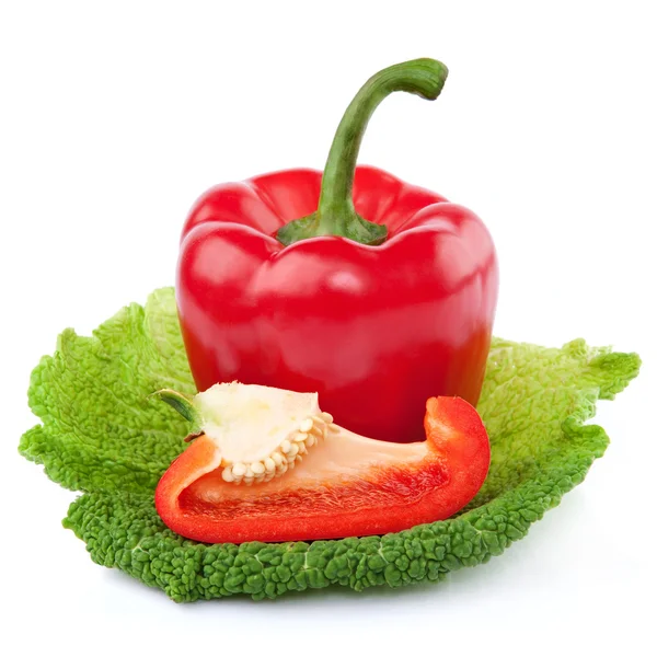 Red Pepper with a slice cut on a piece of cabbage — Stock Photo, Image