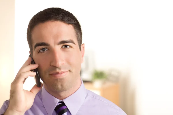 Serious handsome man on cell phone — Stock Photo, Image