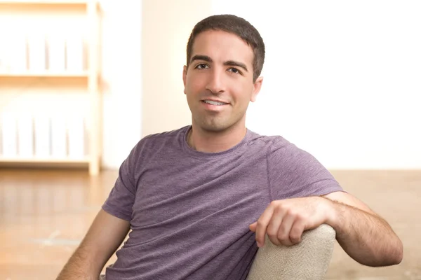 Cute guy leaning on chair — Stock Photo, Image
