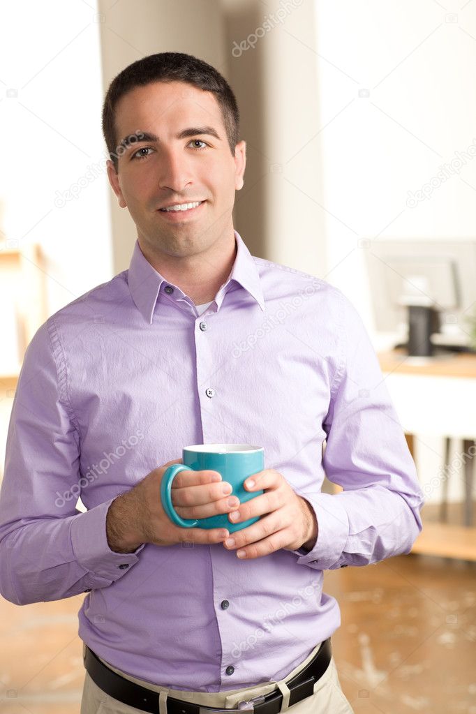 Cute guy holding mug