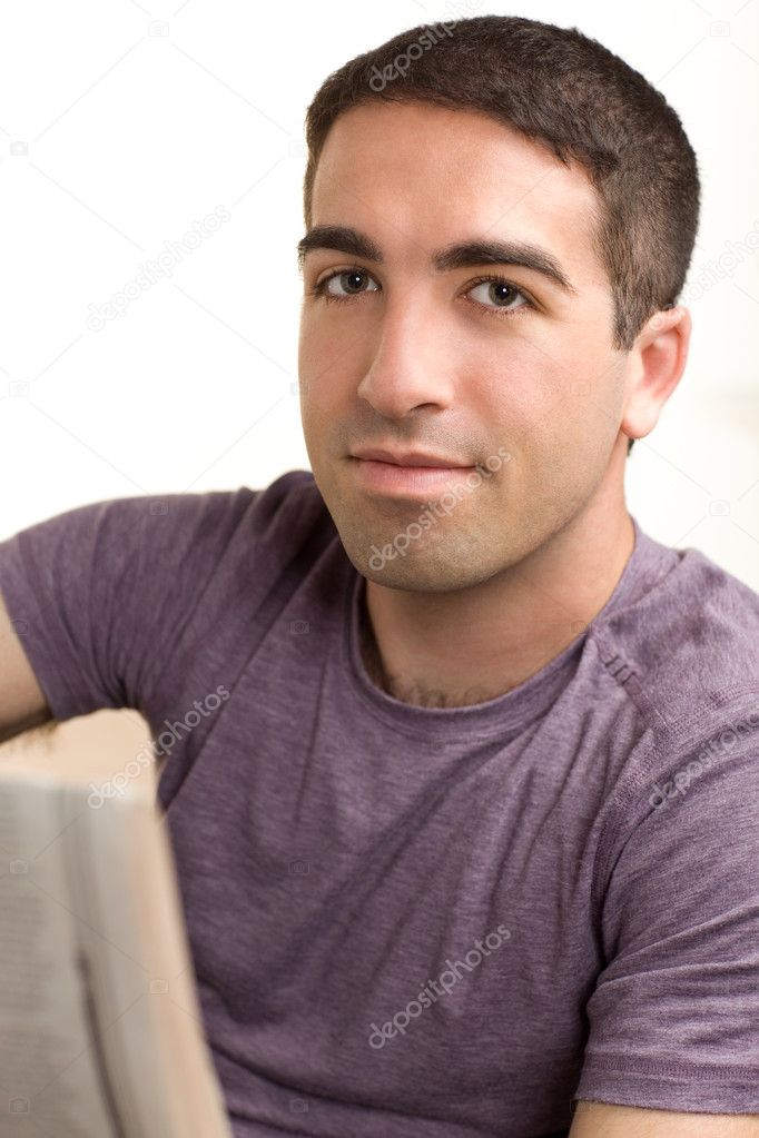 Serious guy reading paper
