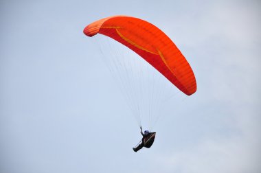 Red Paragliding on sky clipart