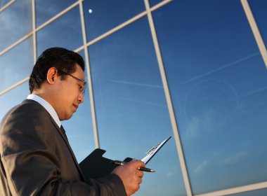 Businessman learning file documents