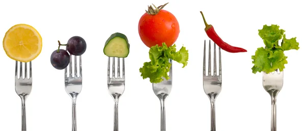 Fruits and vegetables on the forks — Stock Photo, Image