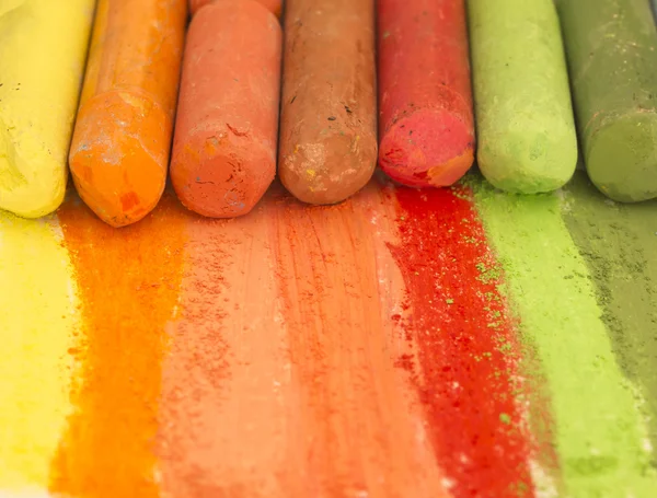 Colorful crayons creating rainbow — Stock Photo, Image