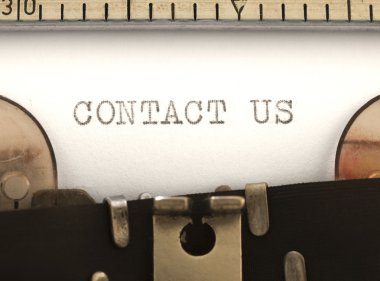 Contact Us title on the typewriter