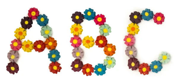 ABC letras feitas de flores artificiais — Fotografia de Stock