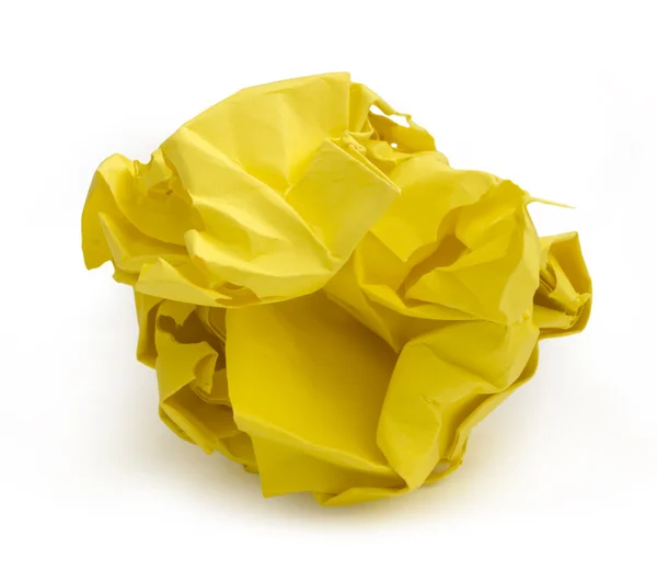 Zmięty papier żółty na białym tle — Zdjęcie stockowe