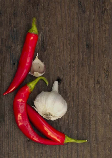 Red chili peppers with garlic — Stock Photo, Image
